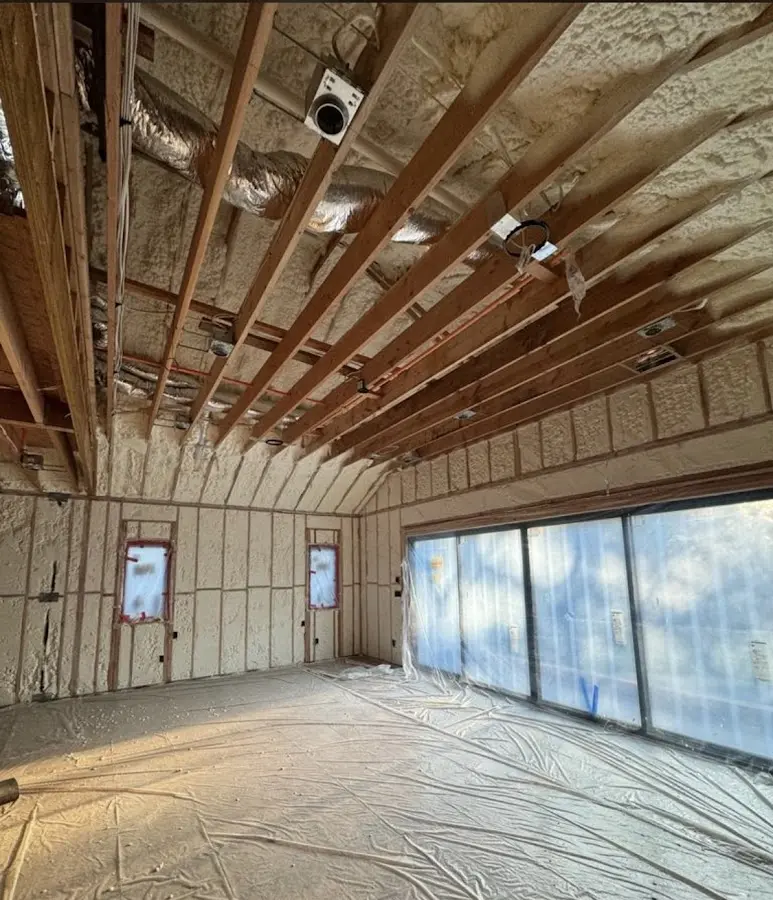 Interior walls and ceiling insulated with spray foam during new construction in Whitehall